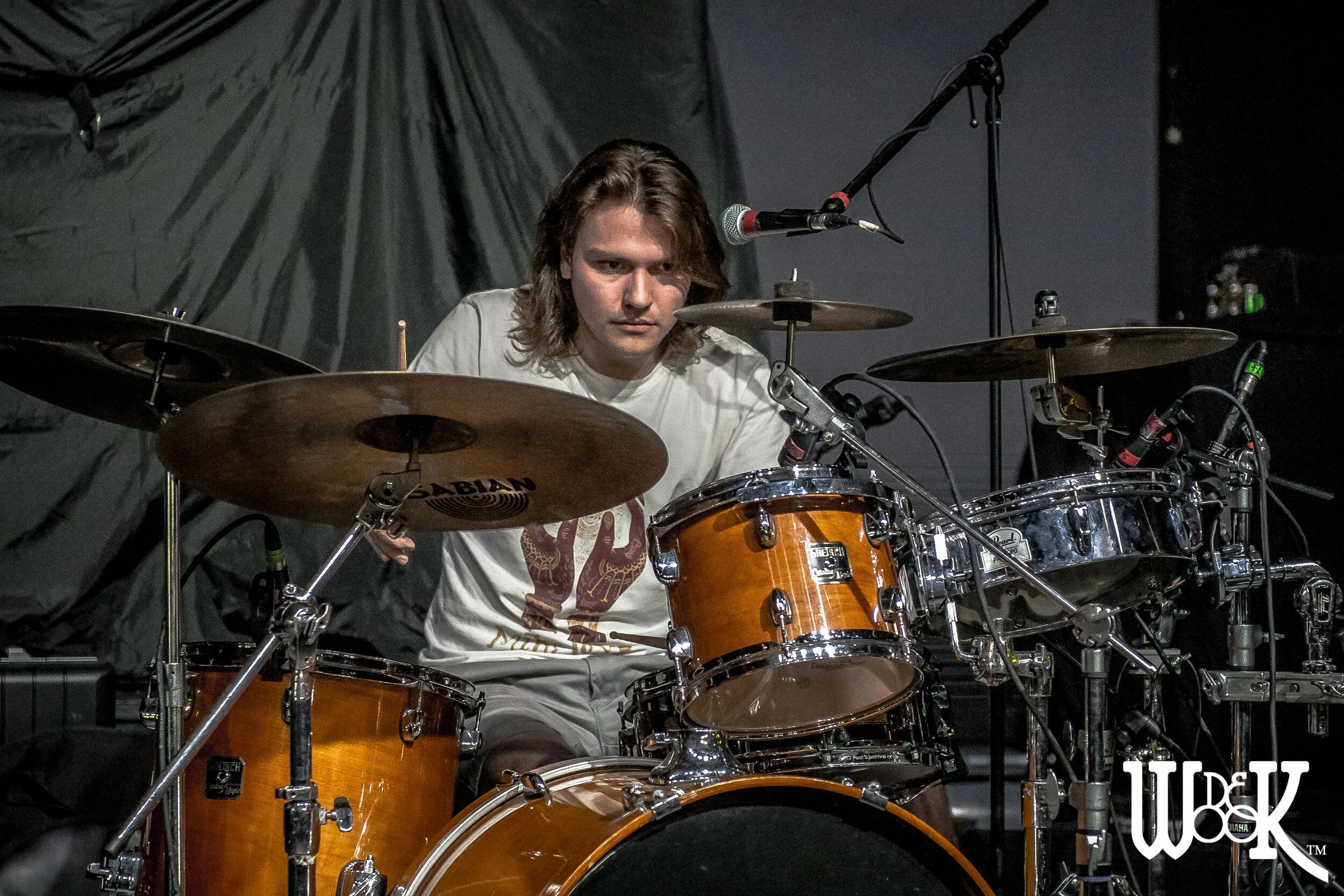 -Graham Brisch Drums and Backing Vocals Graham’s passion for music can be seen in his uncontrollable smile when artfully combines energetic beats with island-inspired grooves that emanate positive energy, This drummers attention to detail allows him to bring an accomplished and seasoned finish to this Trio's sound.