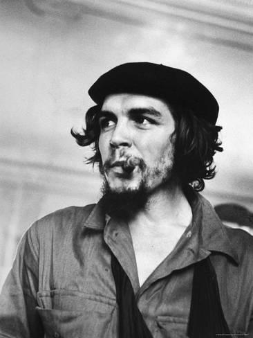 joe-scherschel-cuban-rebel-ernesto-che-guevara-with-lit-cigar-clenched-between-teeth-and-left-arm-in-a-sling_a-G-3834777-4990000.jpg