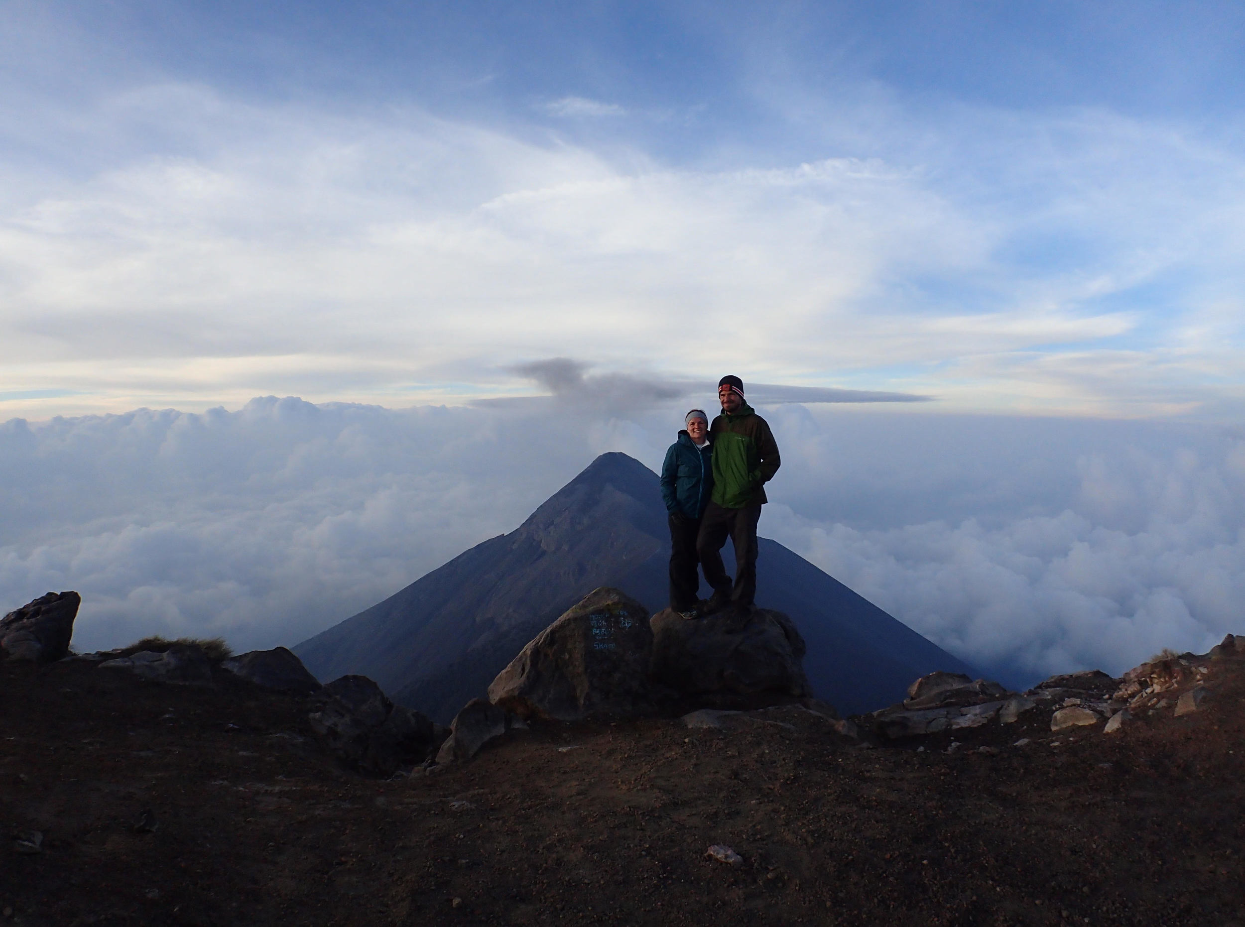 Reaching the summit of Volcán Acatenango just after sunrise with a view of active Volcán Fuego in the background&nbsp; &nbsp; &nbsp;