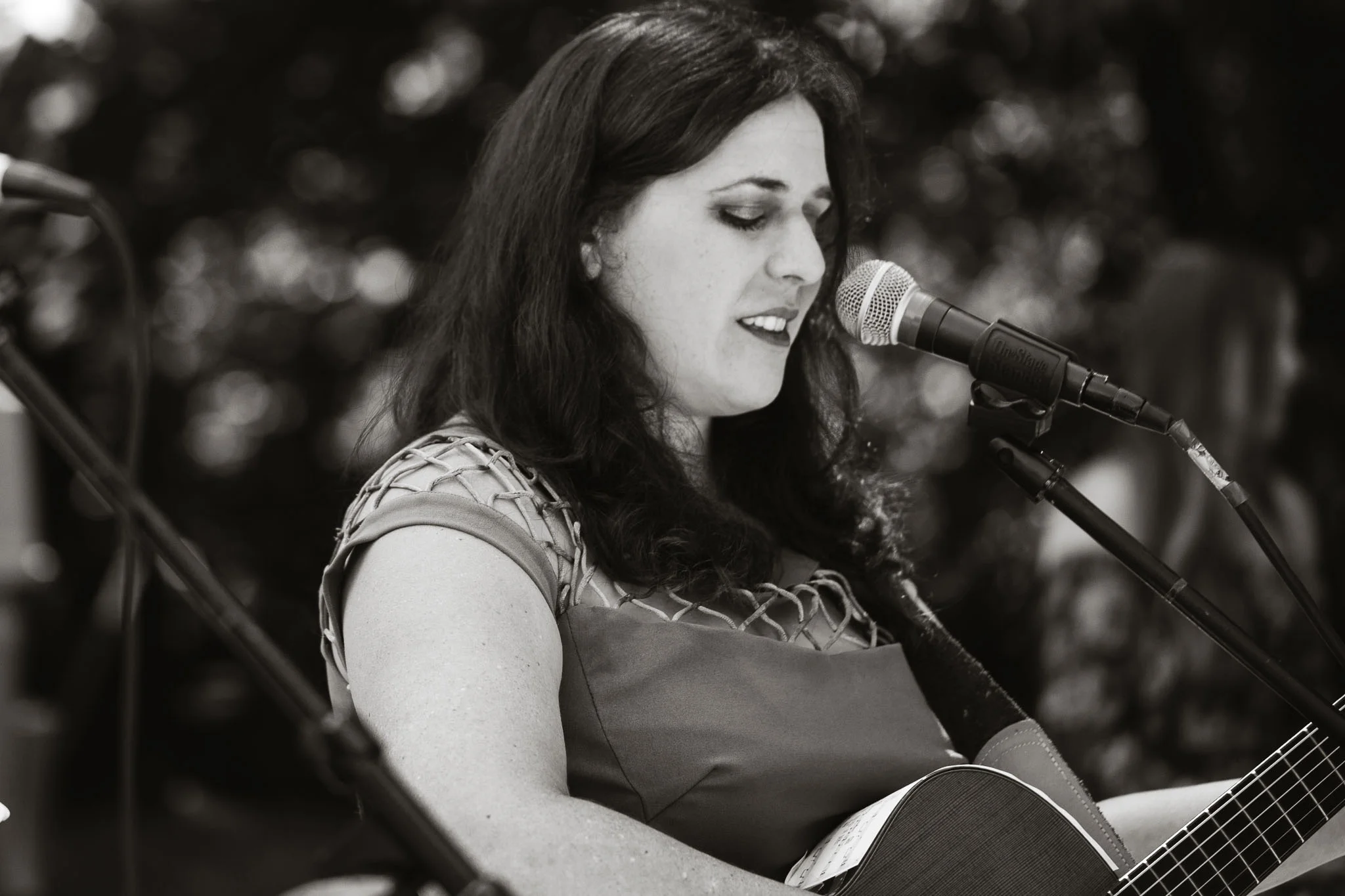 acoustic guitarist sings song as bride walks down the isle - camp long, Seattle 