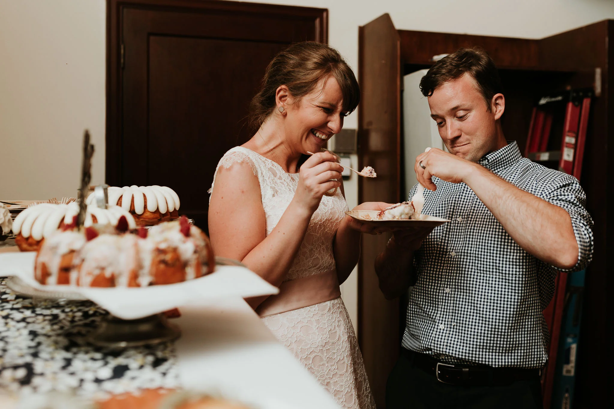 bride and groom cutting their non traditional desert 