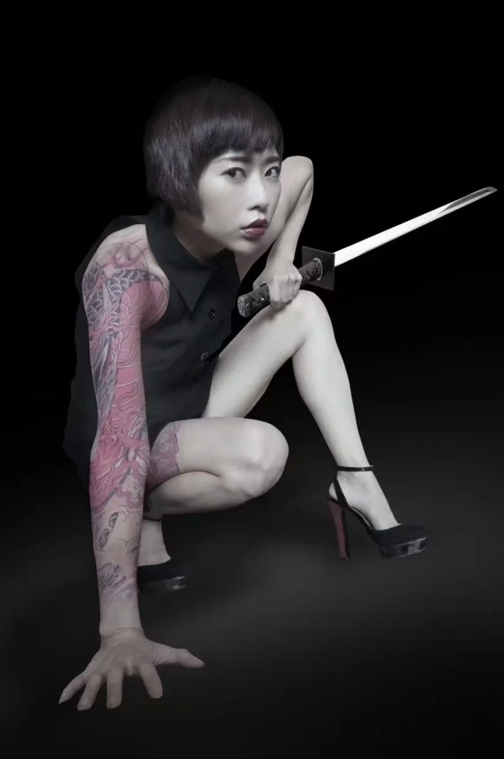Tan Yuanwu. Tattoos and swords edited in by her husband. Photo credit: Tan Yuanwu.