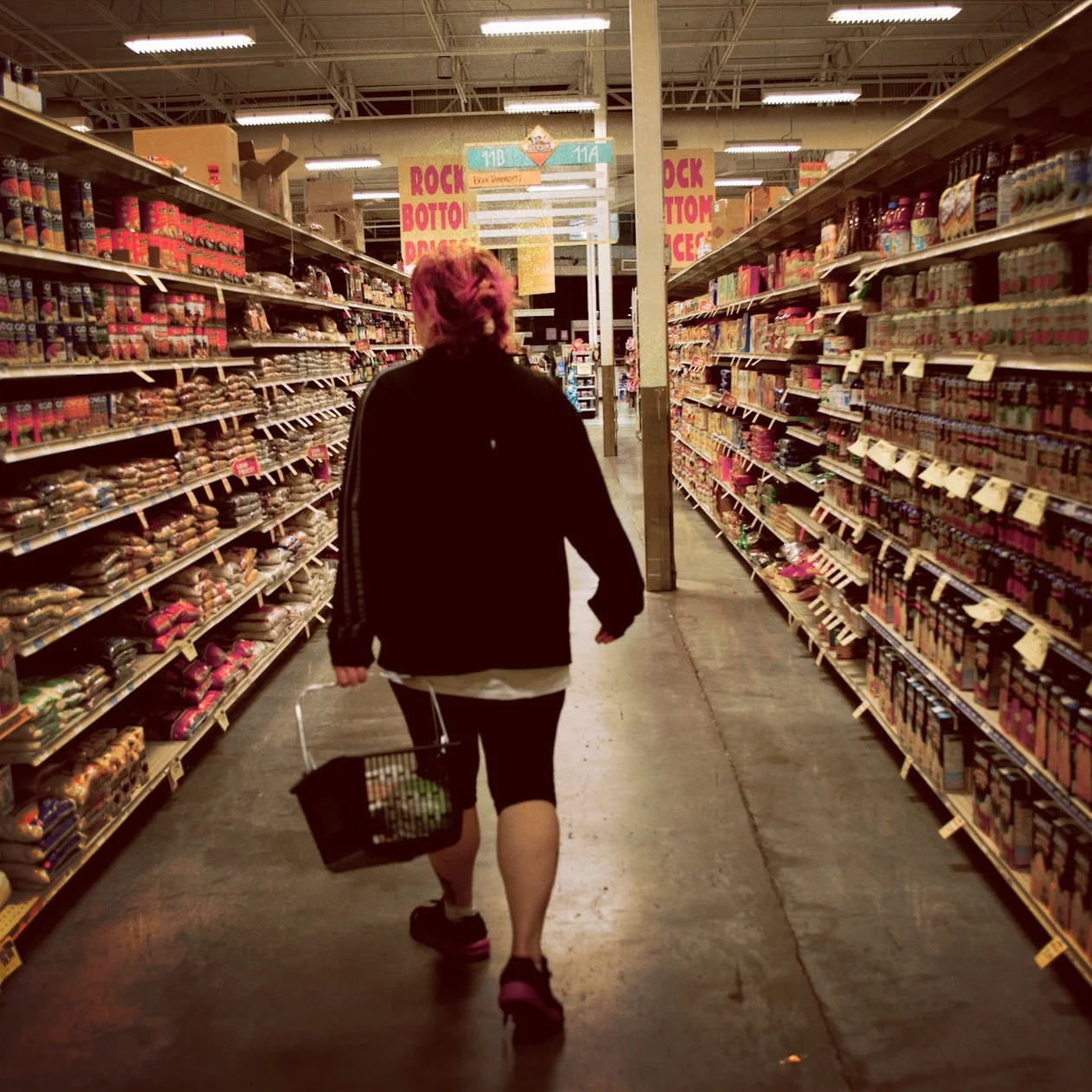 Jane shops for groceries for the special dinner Lisa requested that night. Photo by Tim Matsui.