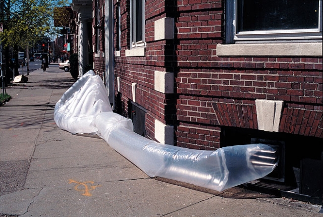 George L.’s para SITE shelter. Made on a budget of $5.00 from trash bags, ZipLoc bags, and clear waterproof packing tape. George requested a system of “ribs” that would be made of semi-translucent trash bags. In between the ribs, he wanted windows to expose the “meat” between the bones.