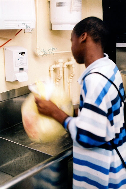   Hyasheem (pictured) led the way and we cooked the chicken according to&nbsp;his&nbsp;specifications, using a shake-n-bake technique.       