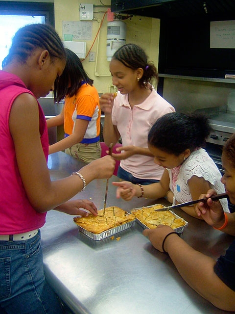 On one occasion, a student walked in and said, “Why are we making this nasty food? They (the Iraqis) blow up our soldiers every day and they knocked down the Twin Towers.” One student corrected her and said, “The Iraqis didn’t destroy the Twin Towers, bin Laden did.” Another said, “It wasn’t bin Laden, it was our government.” In this way, the project provided a space where the opinions, myths and facts that are perpetuated in a country during wartime could be communicated and discussed.