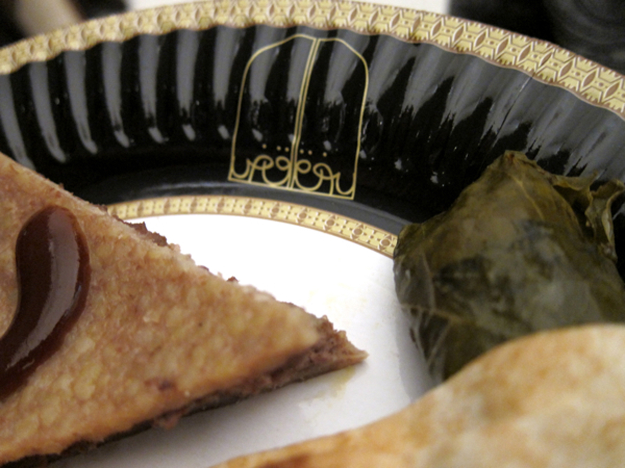   Detail of paper plate replicas of Saddam Hussein's dishes on which food is served from the  Enemy Kitchen  food truck.    