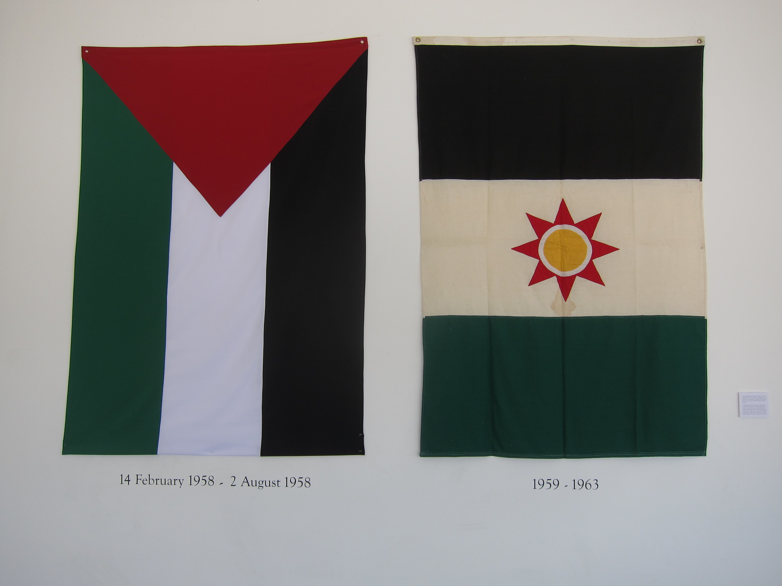   Two Iraqi flags hung inside the restaurant. The first one was adopted for six months in 1958, and was identical to the Palestinian flag. The second was donated by an Iraqi Jewish man who wished to remain anonymous and was a communist back in the 19