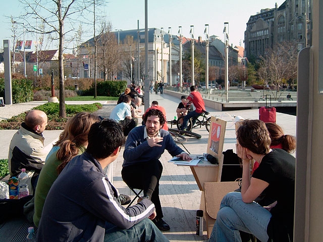 Wearing a sandwich board derived from the temporary structures that display political campaign posters around Budapest, I walked the streets of the city. Removed from the body, the board transforms into a portable drafting studio. Participants were asked to enlist their dreams and visions as a tool to ignite discussion and critical perspective, in an effort to construct alternative visual possibilities that reach beyond the ideas of investors who are influencing the future of these sites.