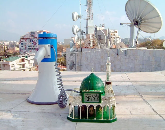 Minarets are the towers of mosques from which the adhan, the call to prayer, is sung by the muezzin five times of the day. The earliest minarets were appropriated Greek watchtowers or any tall architectural structure with an open balcony. Eventually, minarets were included in the overall plan of mosques. Today, the sound of the call is standard in public spaces in the Middle East, North Africa, Indonesia, Pakistan, and India. In Manhattan, where there is a large Muslim population, the call to prayer, if it is sung publicly at all, is usually broadcast at a low volume by mosques, often at ground level.