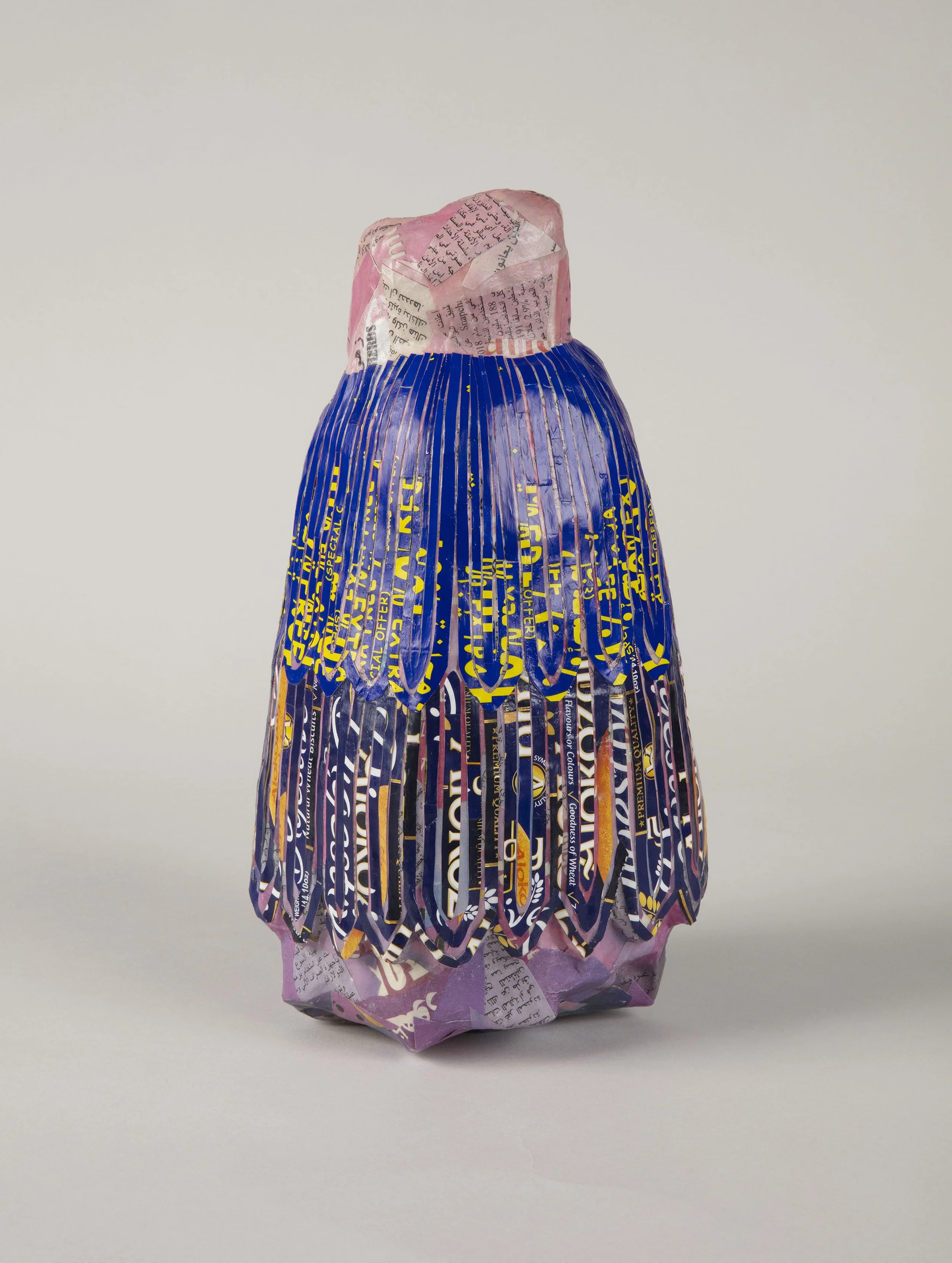 
Fragment of standing male figure; head and body above waist as well as legs and feet missing