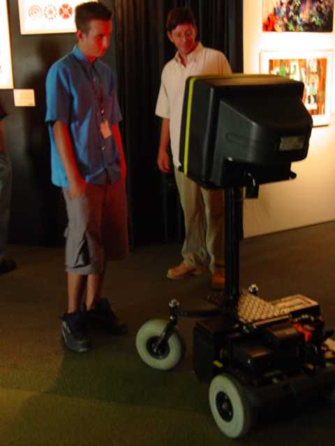 V.R. Keith harassing a gallery visitor at SIGGRAPH in 2001.