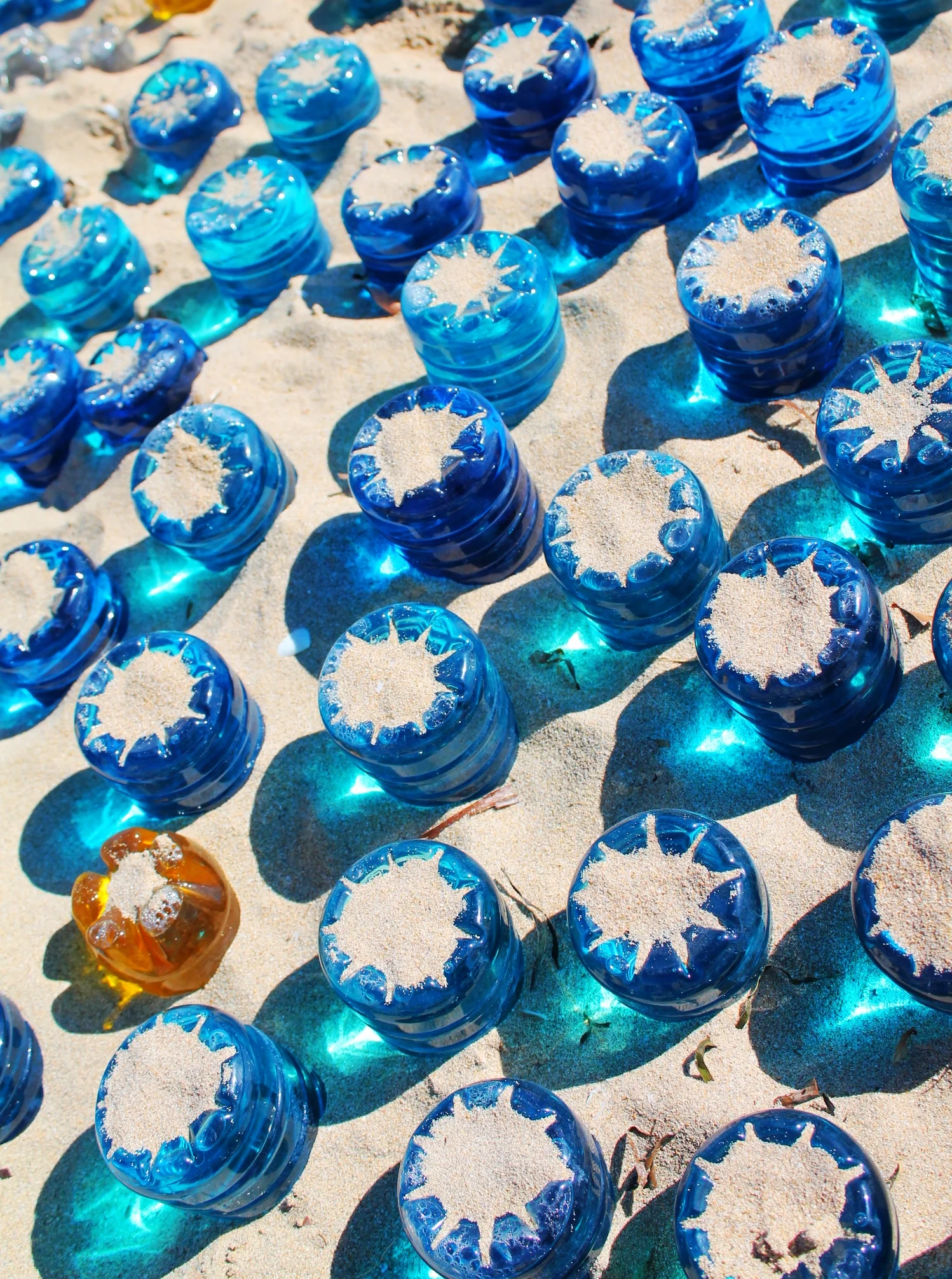 Whale Shark A-001 Stumpy 2013, 300 x 400x 15 cm. plastic, coloured water , solar lighting, QR code, Castaways Sculpture Awards
