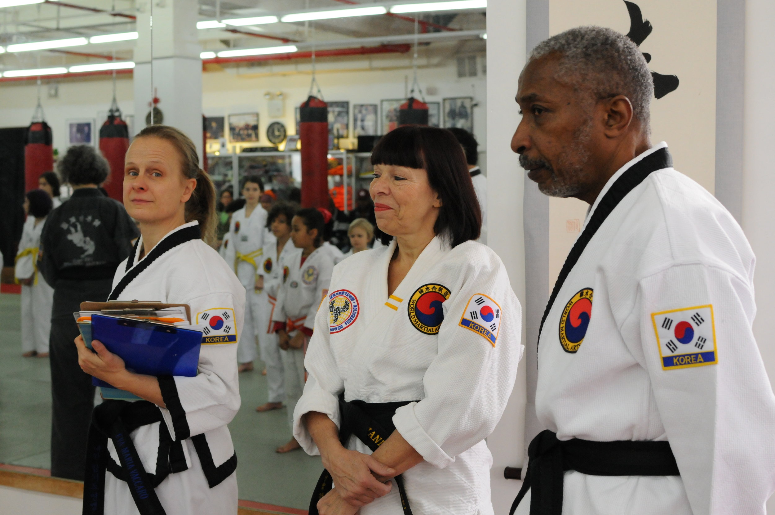 some of the Black Belts suprevising the childrens test.JPG