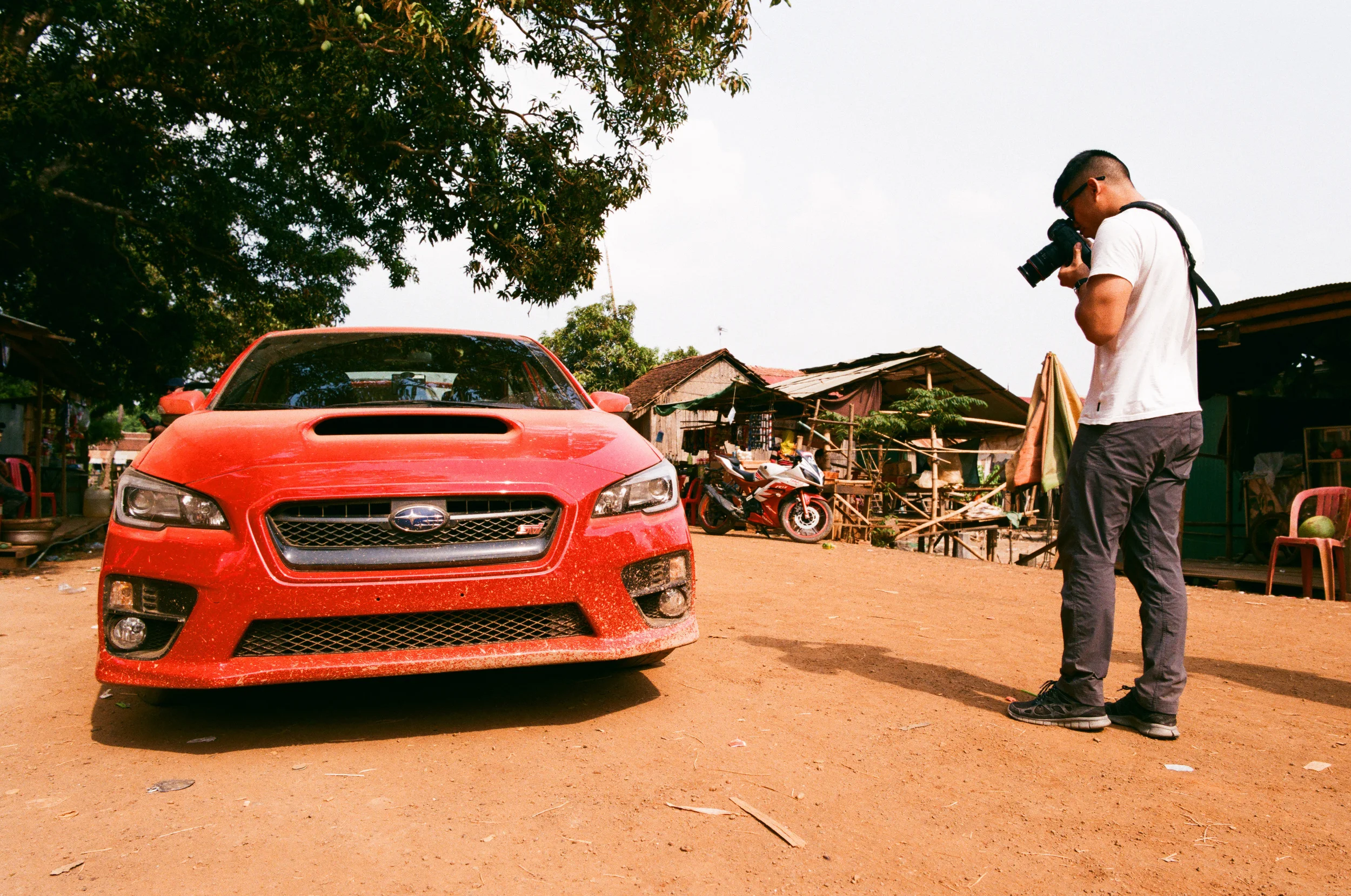 Robin snapping some shots while we wait for a ferry to cross the Mekong River.
