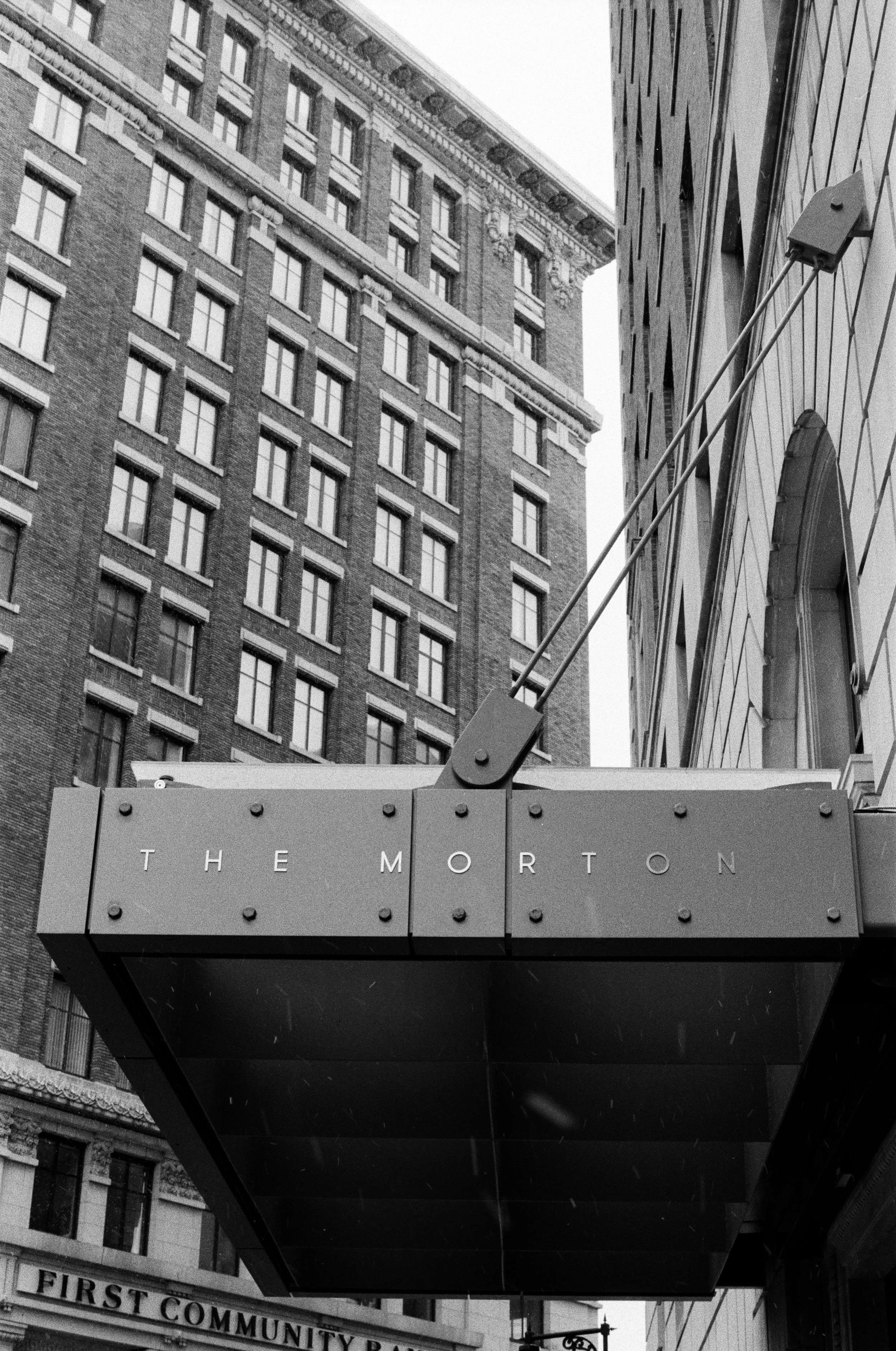 Glass, brick, and metal stacked toward the sky.&nbsp;