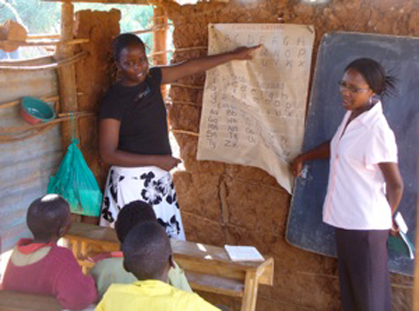  Interns Ann and Neema teach a literacy course at Lobarishareki Primary School. 