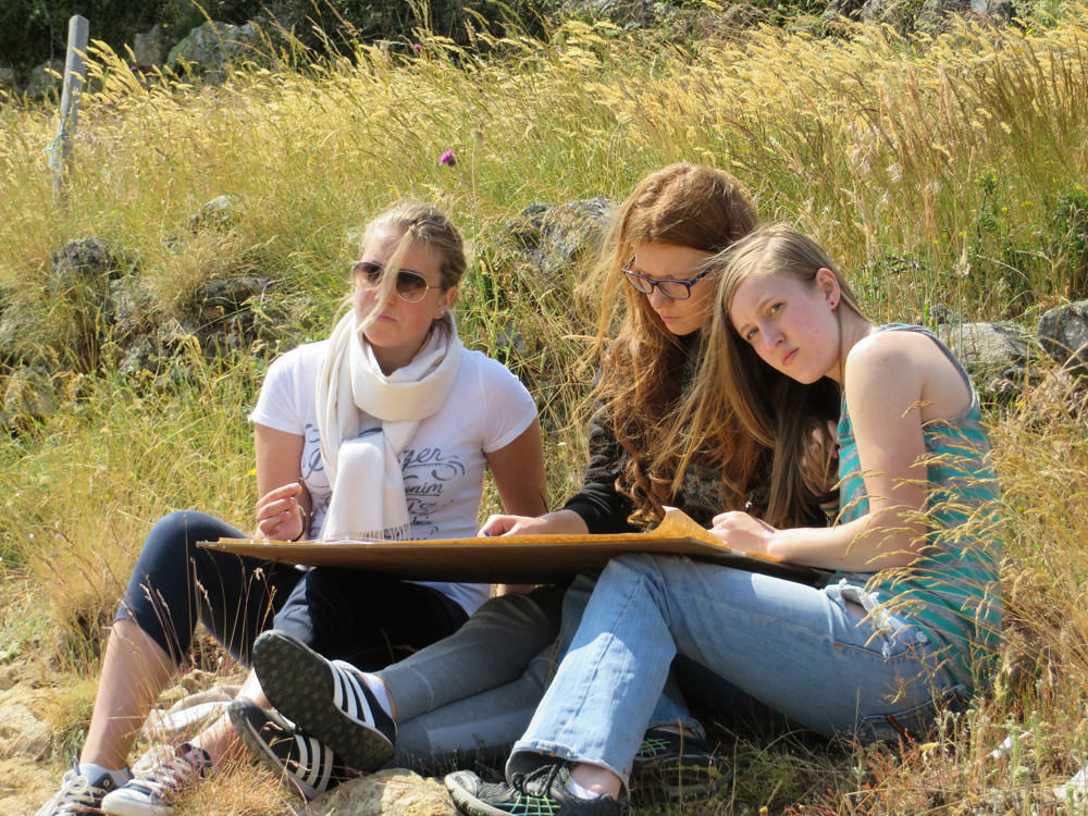 students drawing in the landscape