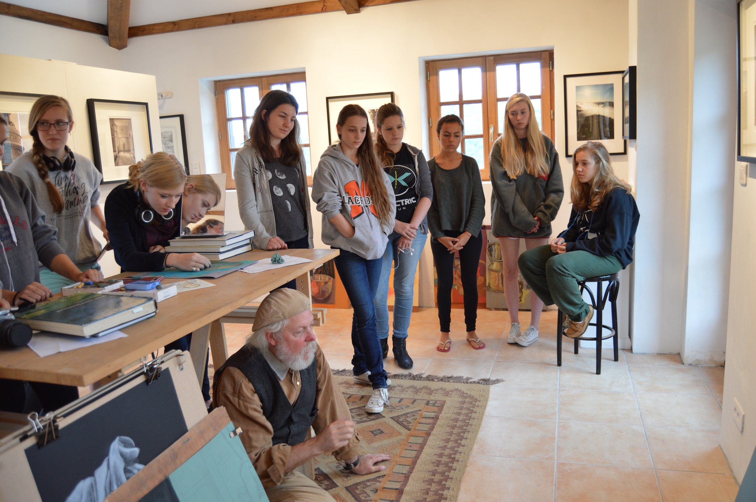 students discussing their work in the gallery at les tapies