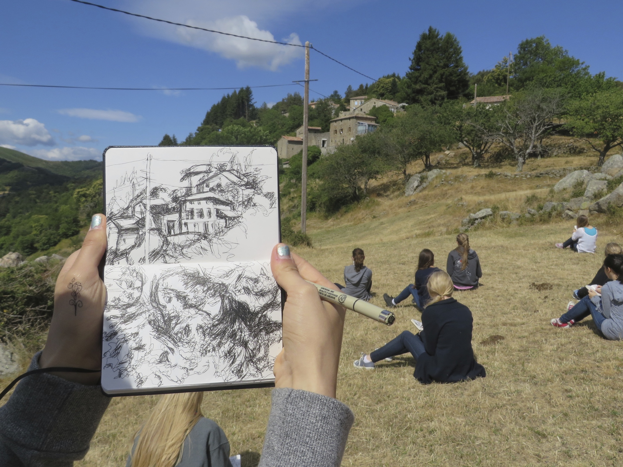 students drawing in sketchbooks in les tapies drawing and painting courses