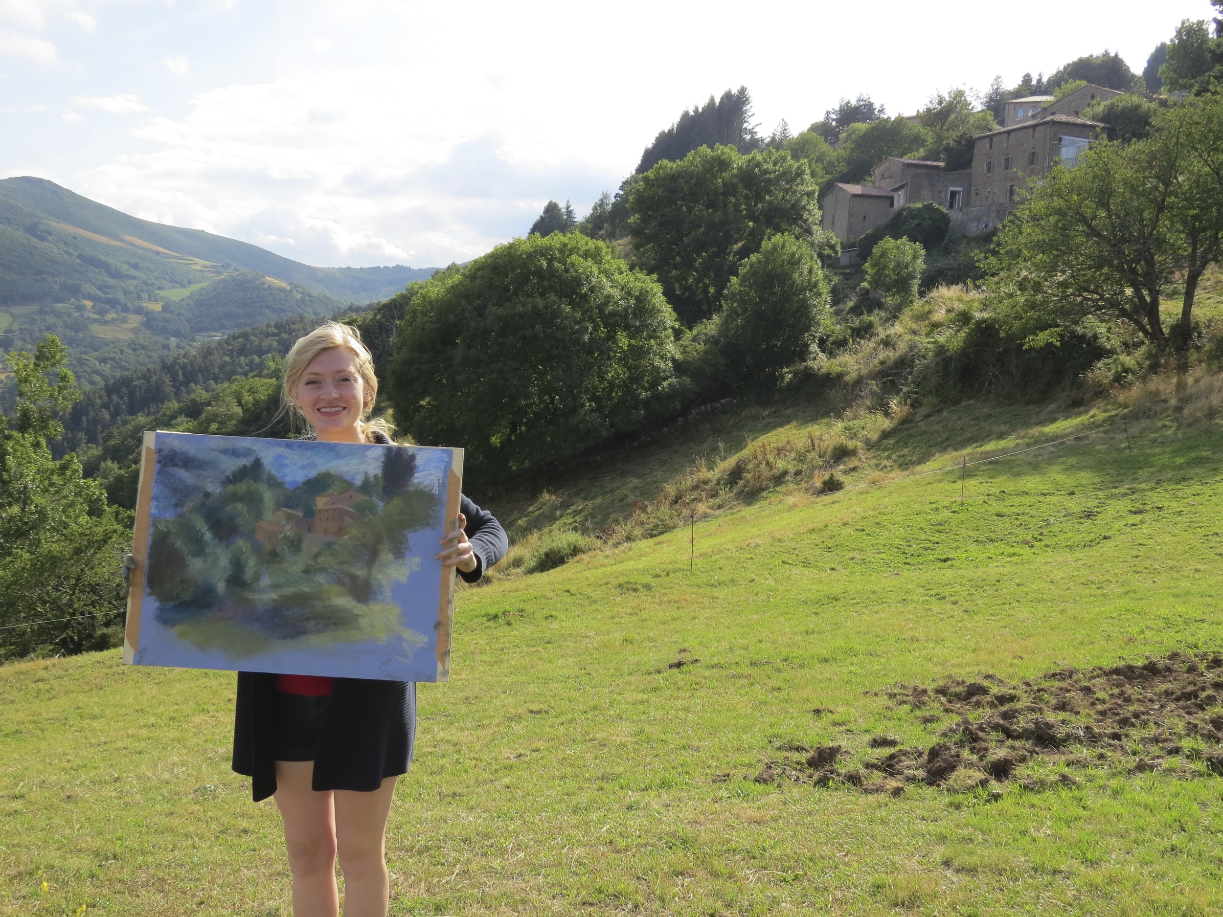 a student with her pastel landscape drawing les tapies summer programs