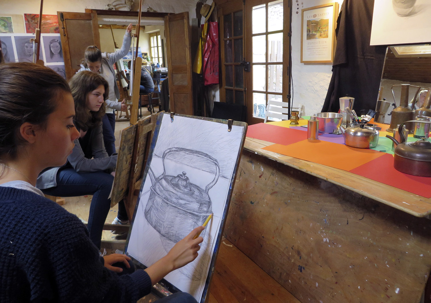  high school students working on still life drawings&nbsp; 