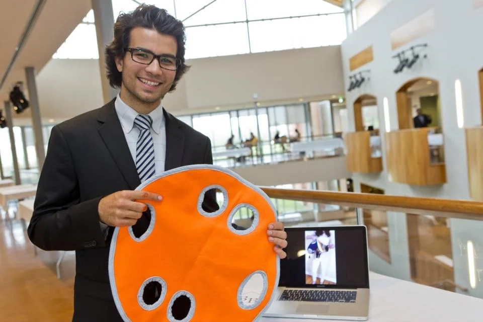 Bryce Bandish displays the Pet Pita at Clarkson's Innovation Showcase in 2013.