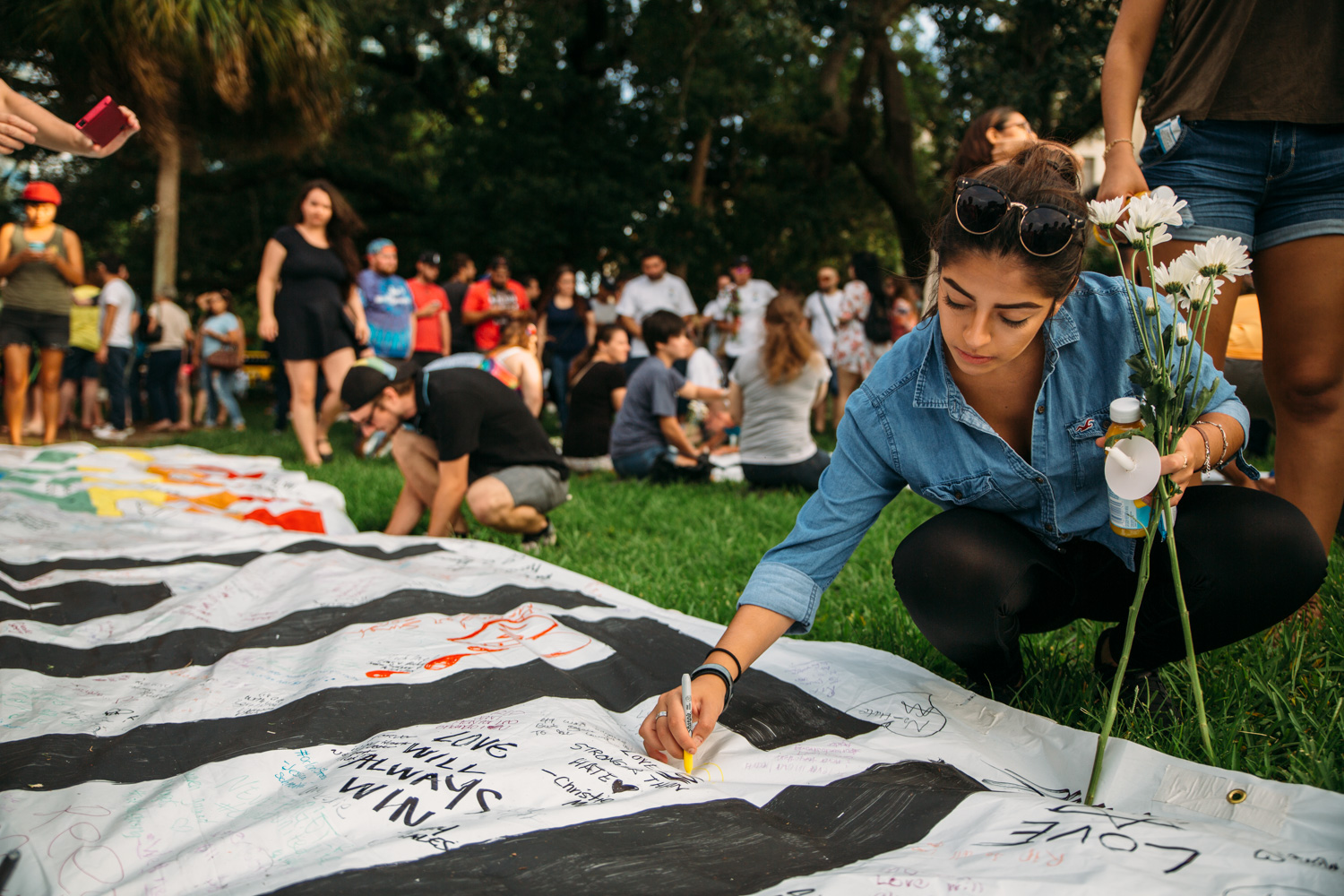 Hundreds wrote personal messages to the victims on the enormous "OrlandoUnited" banner.