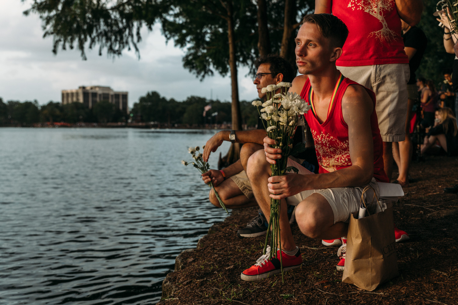 This man sat at the water's edge and gave out flowers to any who wanted one.