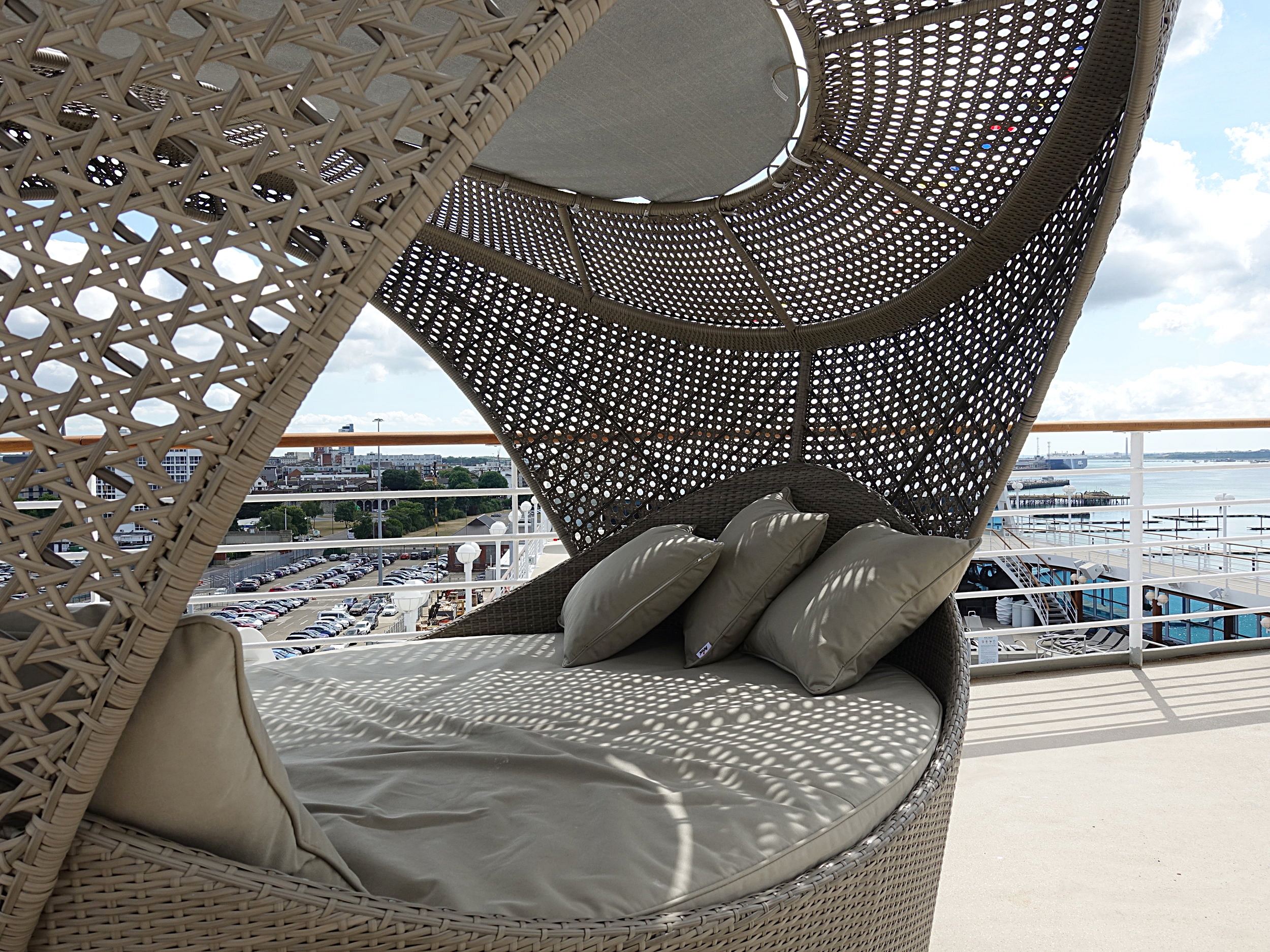 Oval shaped canopied day beds on the upper decks.