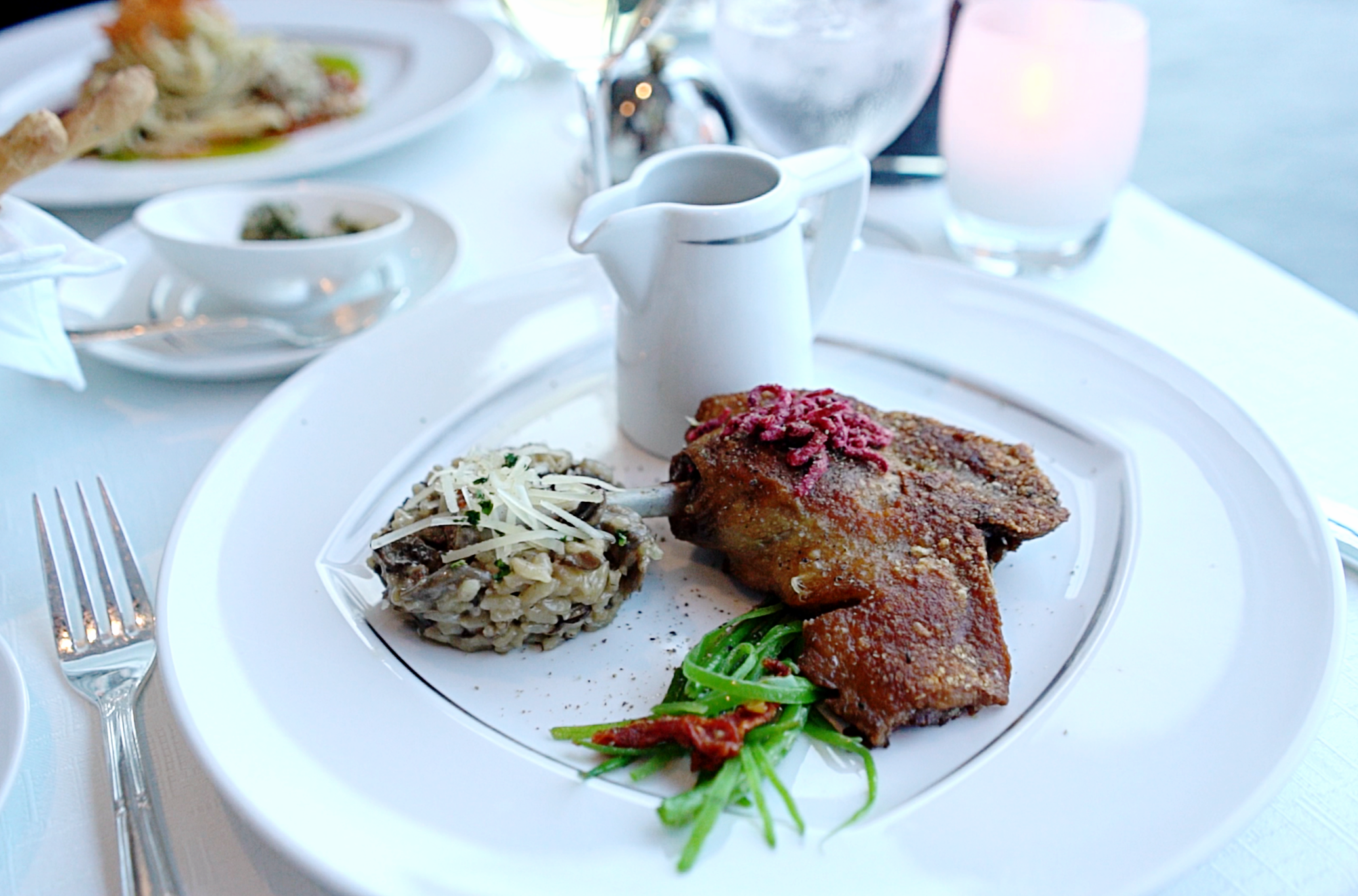  The mushroom risotto and duck leg confit in the Aqualina restaurant.  