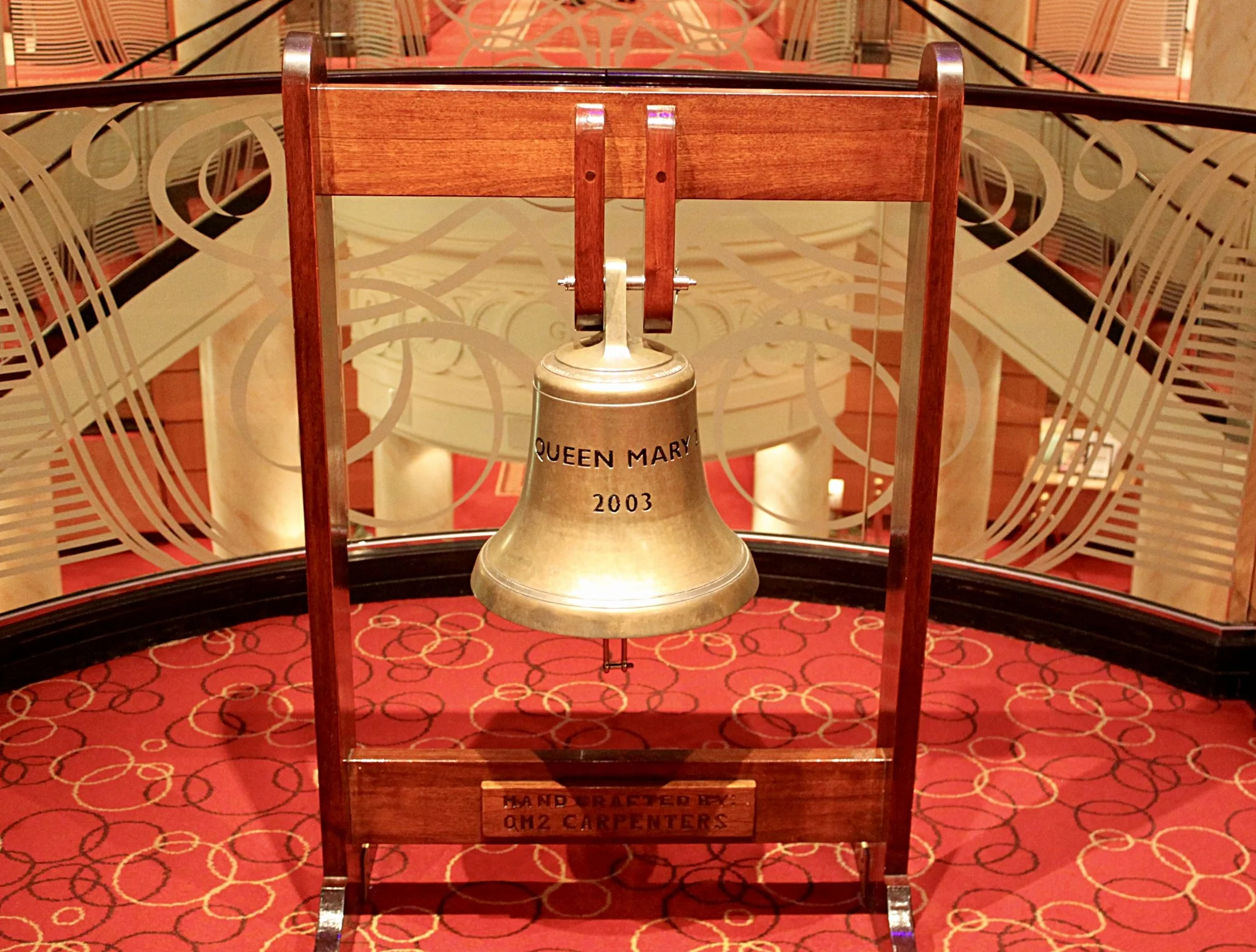The infamous Queen Mary bell situated in the Grand Lobby of the Queen Mary 2.