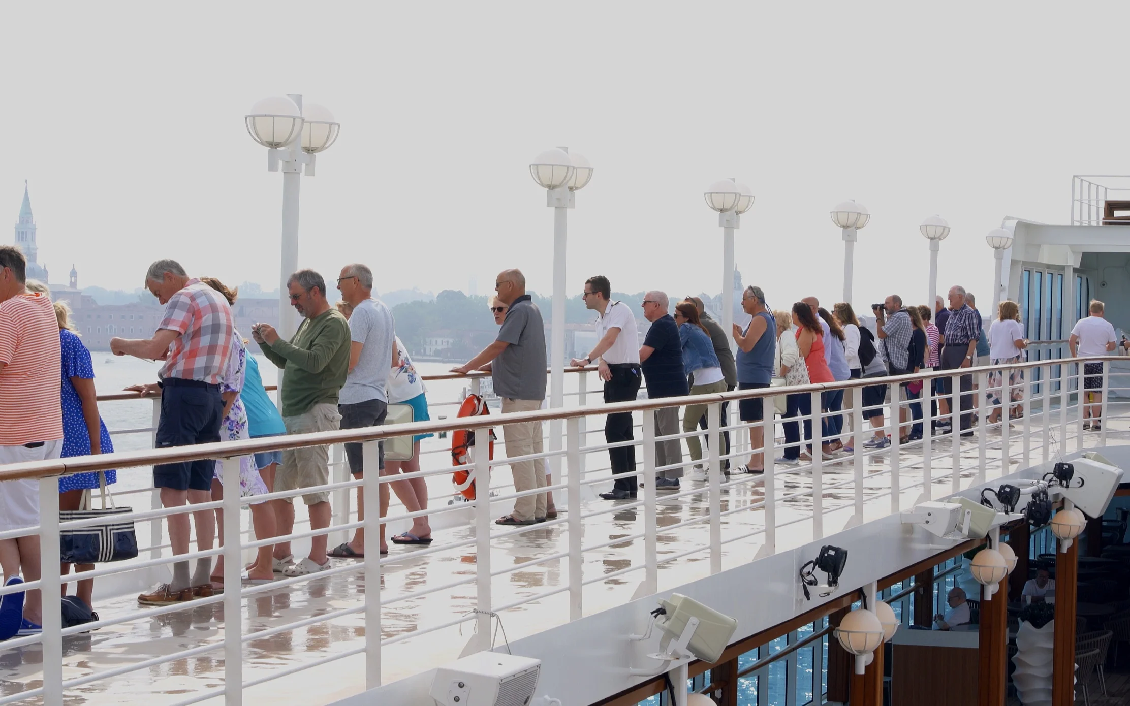 Guests on the open decks for sail into Venice.