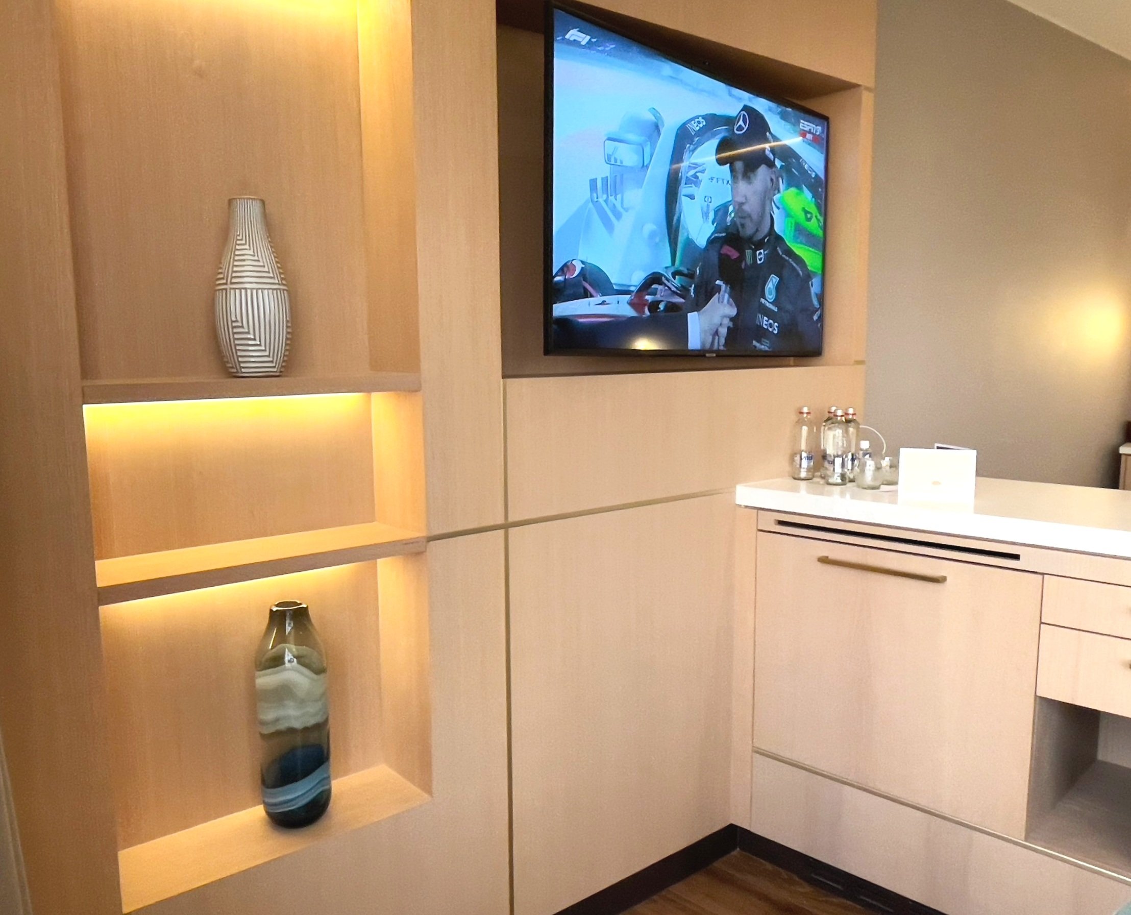 The TV in the wall unit and the minibar cupboard