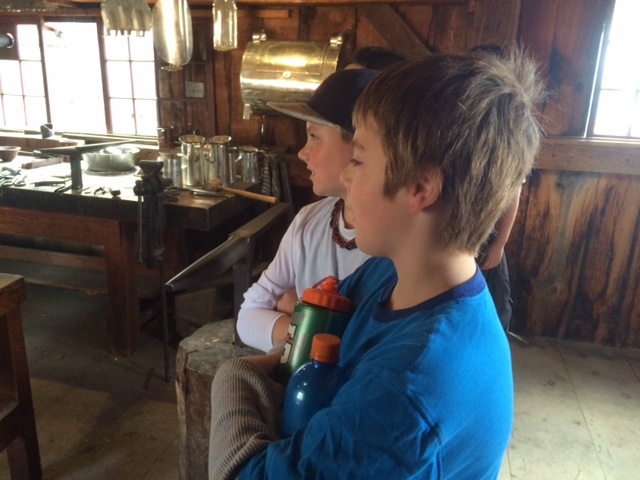 CTES 6th graders observing the Tin Smith at Sturbridge Village. 