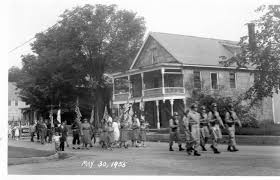 Memorial Day Parade in Cavendish May 30, 1955. This picture was taken in front of the current Black River Health Center Building. The porches have been removed.