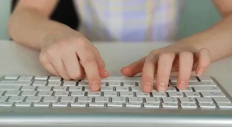 kid-hands-use-computer-keyboard-260nw-2643280603.webp