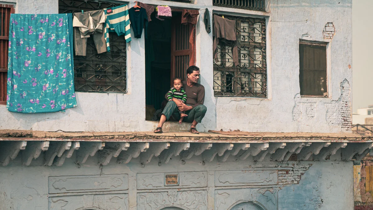 Father and Son in Window, India