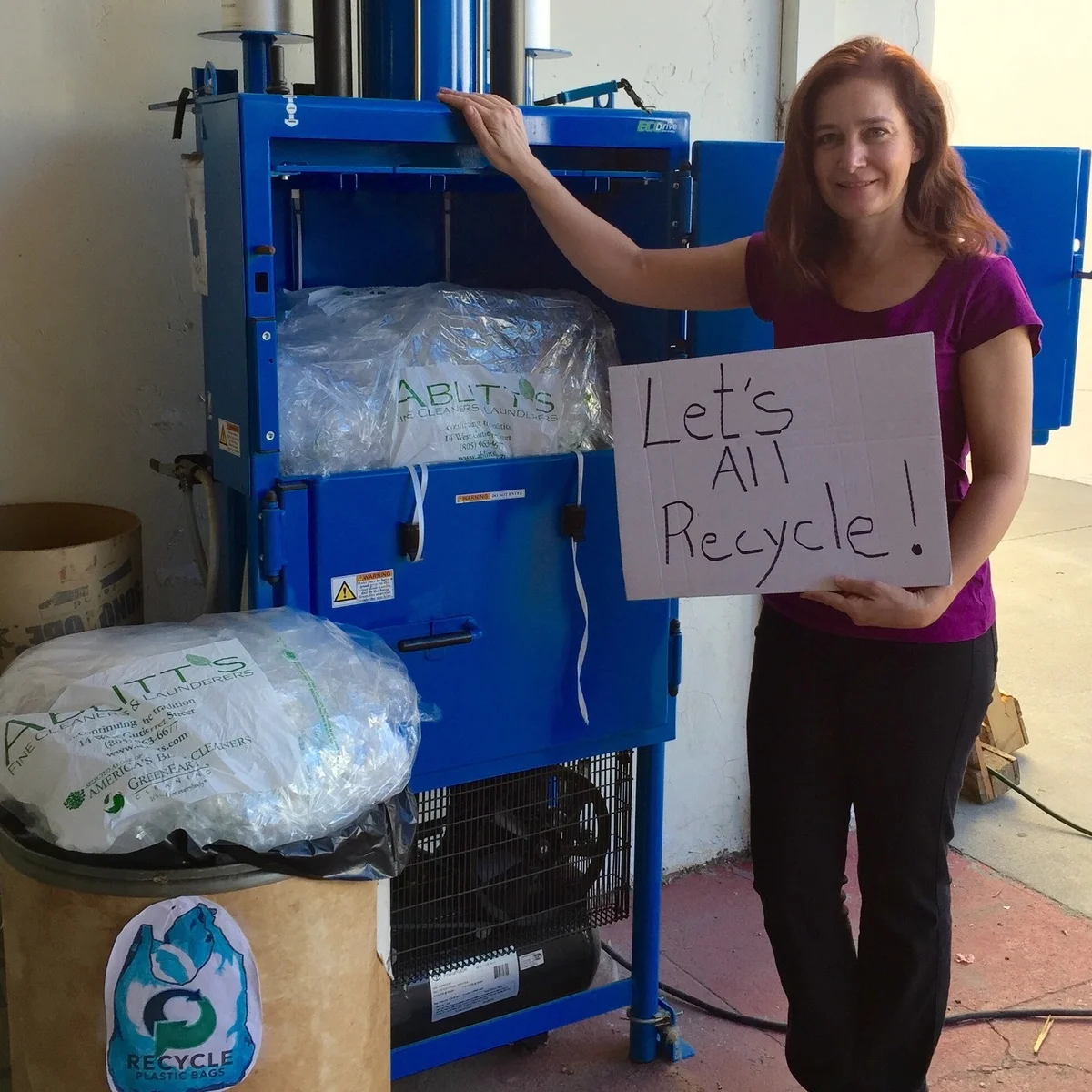 Sasha Ablitt, of Ablitt’s Fine Cleaners and Launderers, next to the company’s bailer machine, which compresses film plastic for pick up by Trex.
