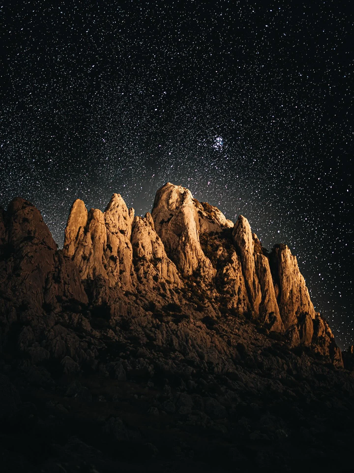Getting a lot of love on this photo and couple people asking how I got it.

No tripod sadly so my rucksack and some rocks propped the camera still. 

Shutter set to 2 second timer so no camera shake caused by me. 

Shutter - 20 seconds 
Aperture 2.8

