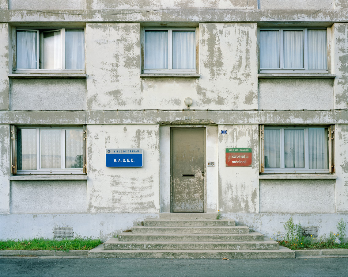  Banlieues #3 –&nbsp;Cité Montceleux, Sevran, Seine-Saint-Denis, 2006. 40"x50"   l'habitat marginalisé artist's statement   These apartments are occupied by well-educated middle class teachers who work at the public school adjacent. As a part of thei