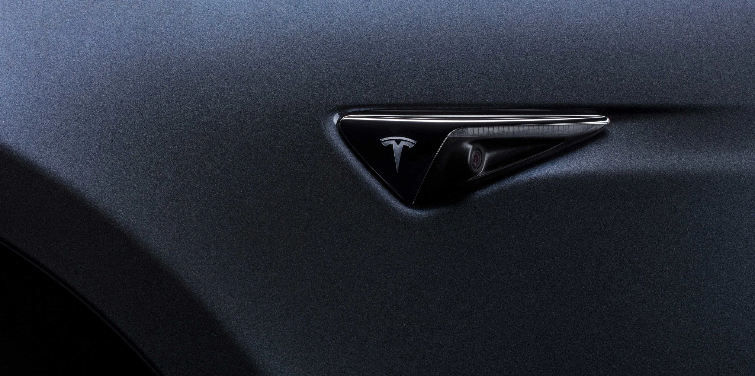 TESLA-CAR-CAMERA-BADGE-UPDATE-2019.jpg