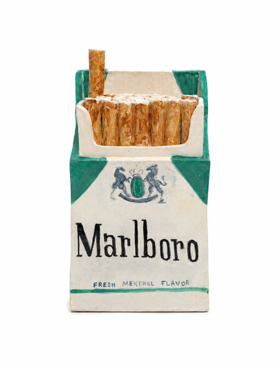 A vintage-style pack of Marlboro cigarettes with a green and white design, featuring a crest with two horses, and a few unlit cigarette sticks inside, labeled "FRESH MENTHOL FLAVOR."