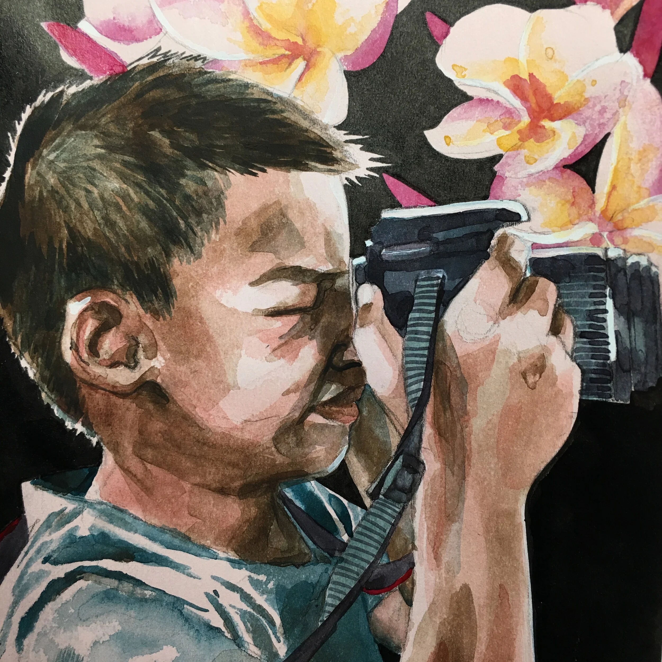 Portrait of Justin with camera and plumeria