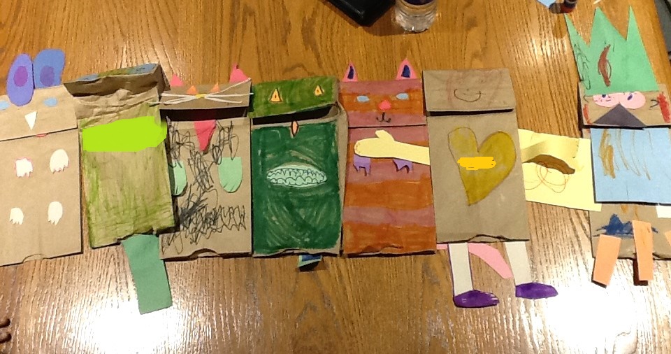 The kindergarteners' completed paper bag puppets