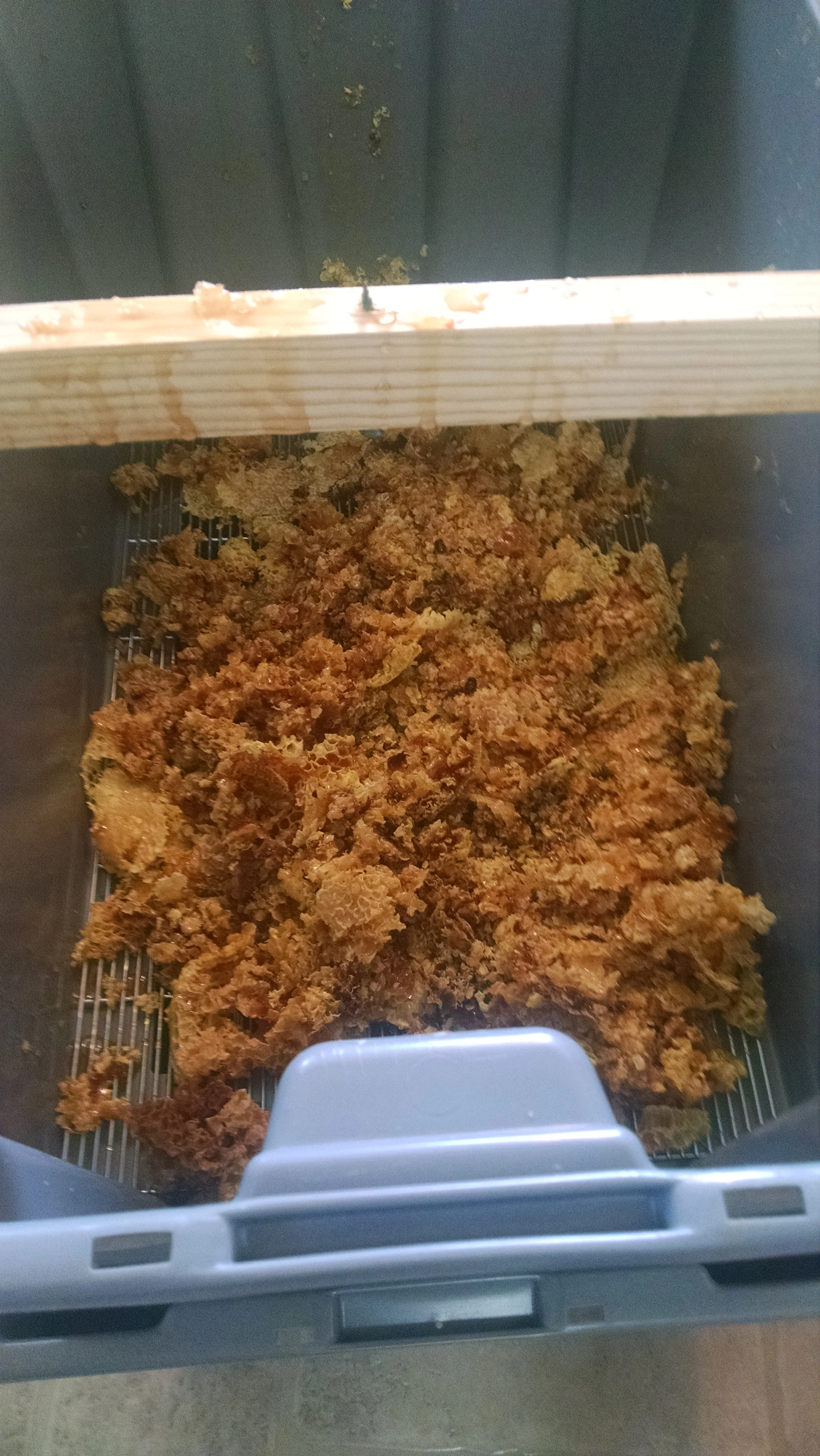 All the honey dripping out of the wax cappings. Saved a good two pounds of honey this way!