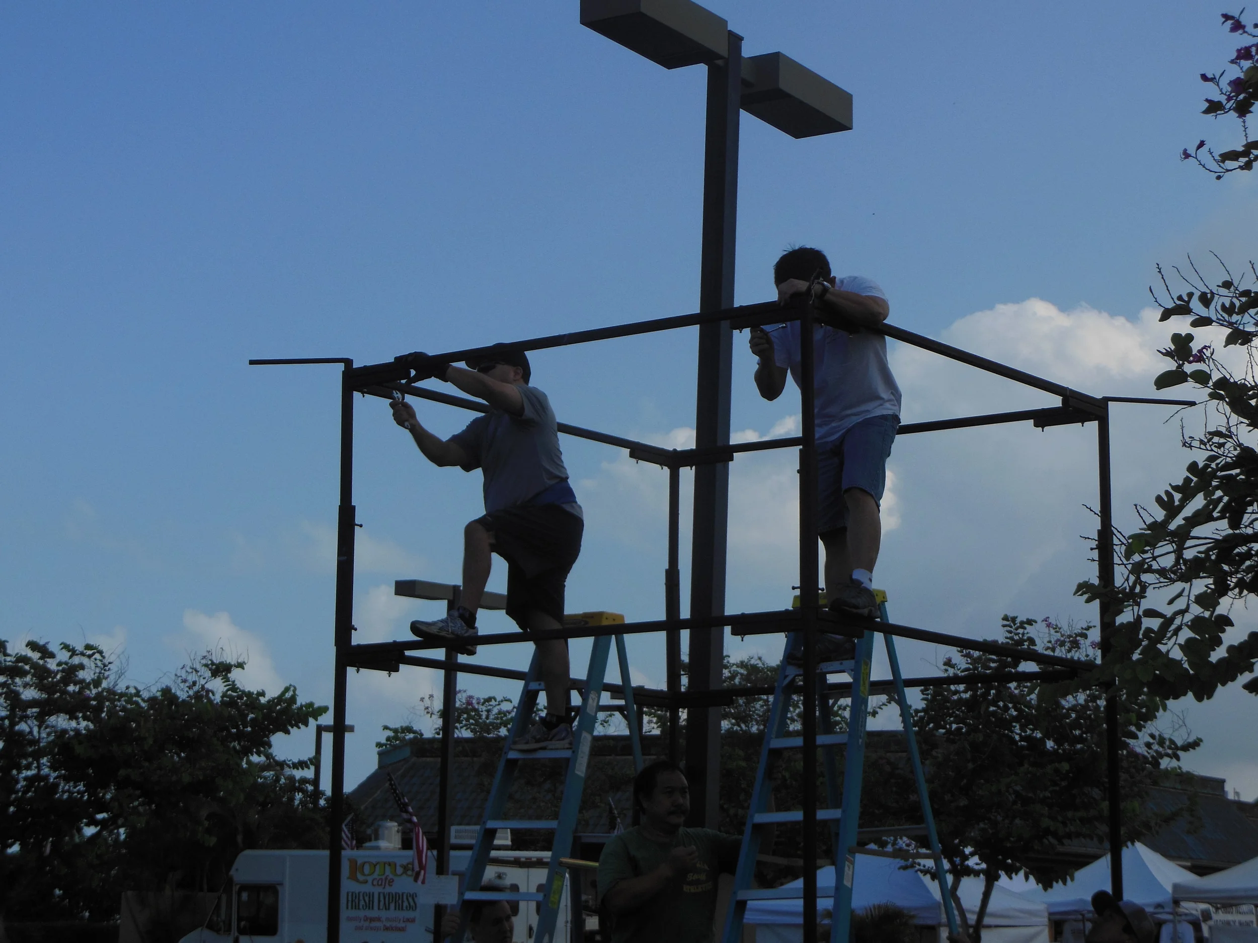 Members of the Kona Hongwanji Shinwakai help put together the yagura.