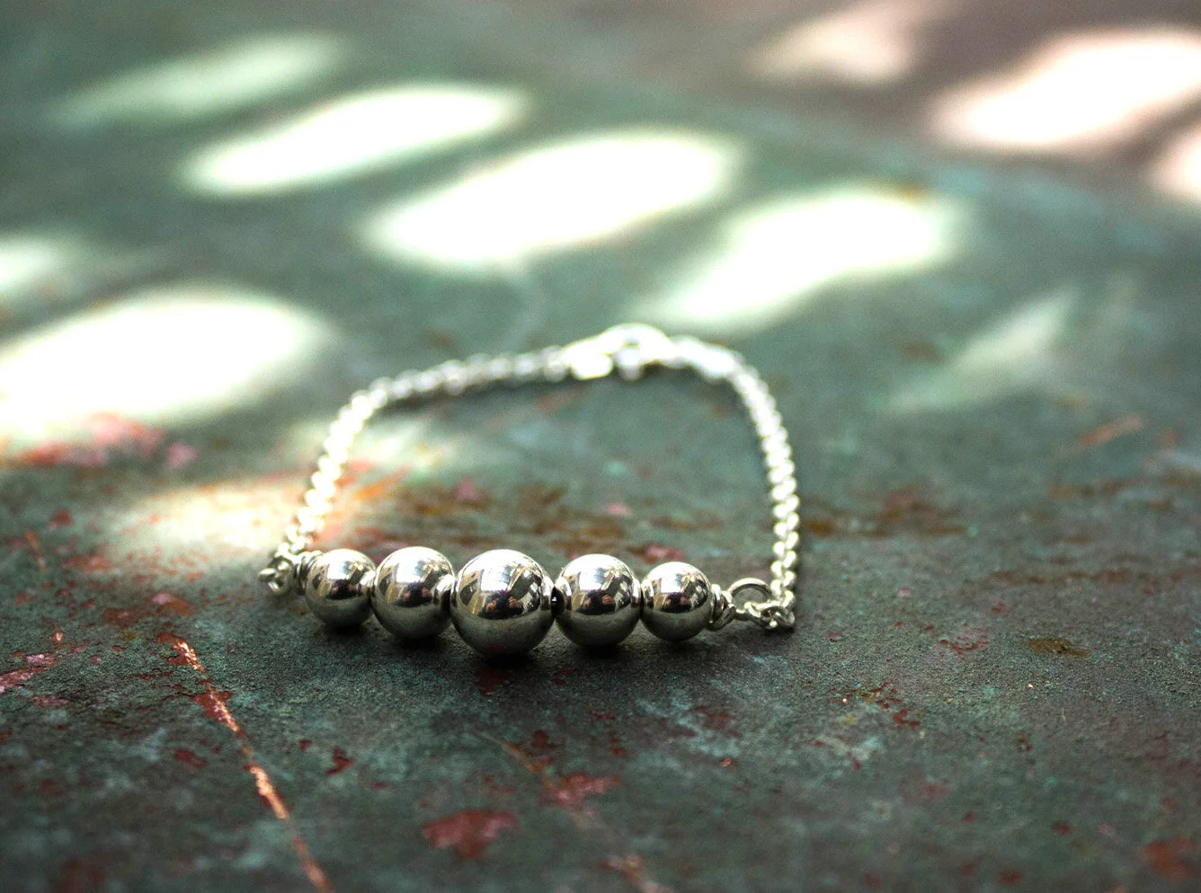 Silver-Goose-5-bead-bracelet.jpg