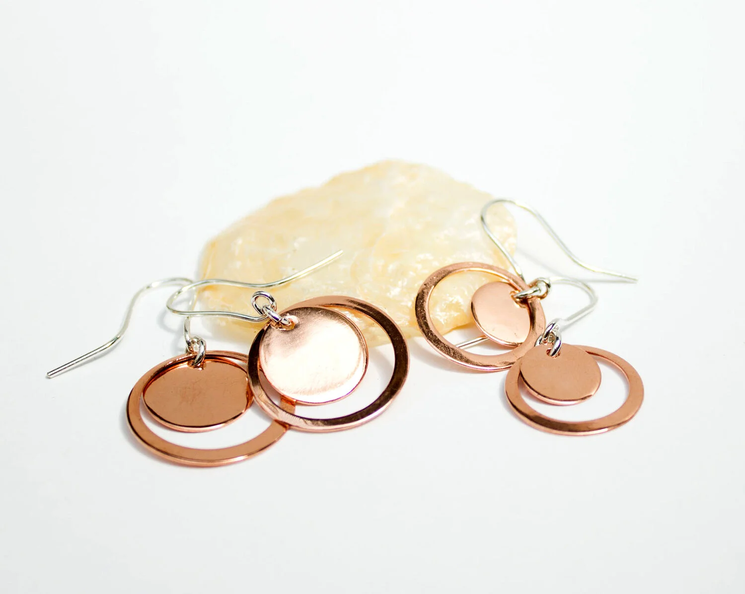 silver-goose-asymmetric-copper-disc-earrings.jpg