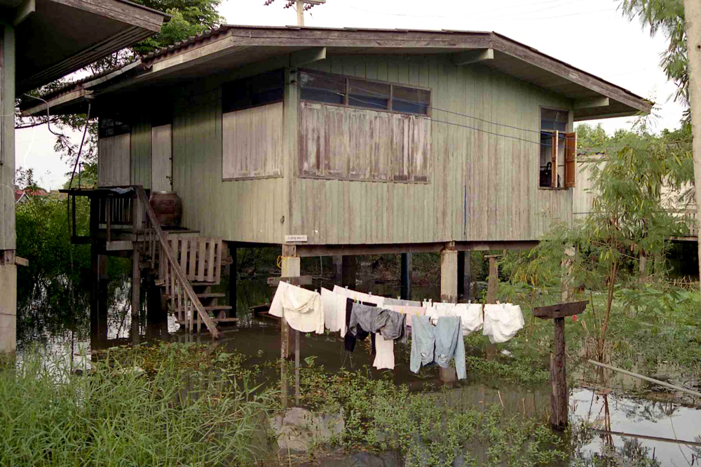 I lived in teacher housing while at Sa Klee school. This is my house during the annual floods — the infamous sewer pipe can be seen beneath the house behind the drying clothes. At this point the floods were still rather low. In the following weeks the floods would rise and overflow the dike protecting the school.
